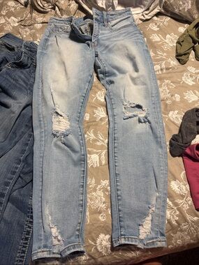 Buckle Light Blue Distressed Skinny Jeans